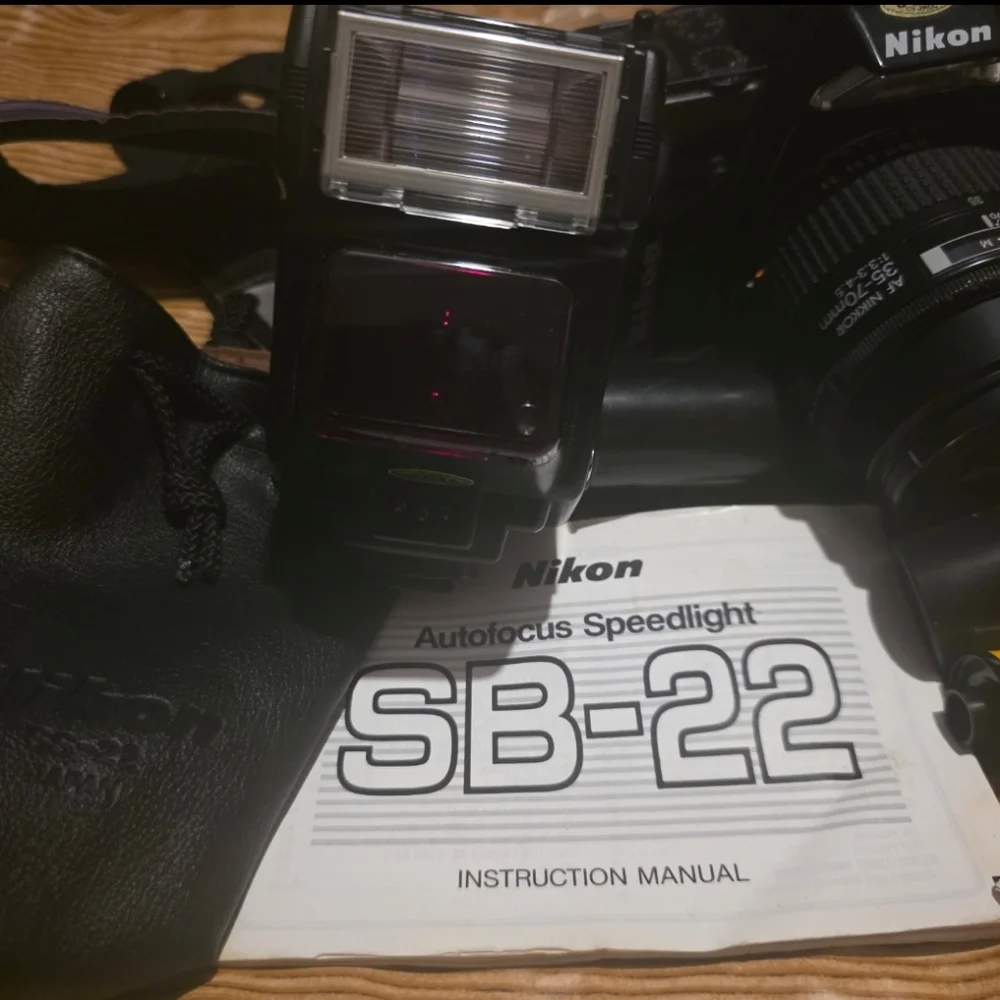 Nikon N4004 AF camera w/ 2 lenses, Flash, Film and Accessories